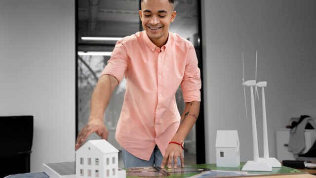 Land promoters in Chennai presenting a residential layout model with plotted development and infrastructure planning