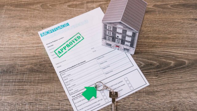 "A real estate professional or legal expert explaining the property registration process and documents like the Sale Deed and Encumbrance Certificate to a homebuyer in an office."