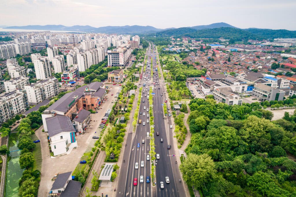 Aerial view of Tambaram showcasing major road connectivity, residential developments, and green surroundings ideal for Tambaram land investment